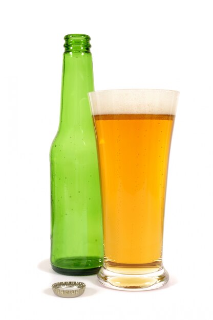 Beer glass with empty bottle