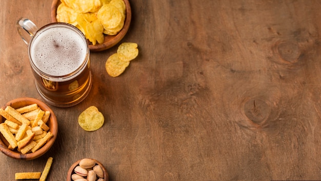 Beer mug and chips with copy-space