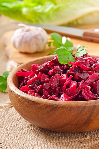 Beet salad Vinaigrette in a wooden bowl