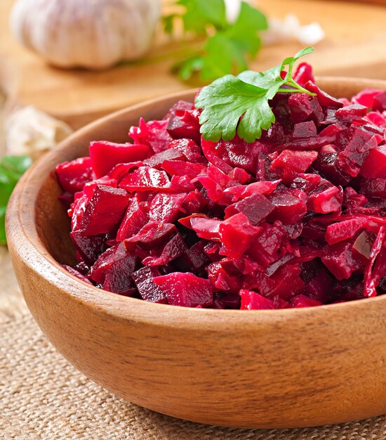 Beet salad Vinaigrette in a wooden bowl