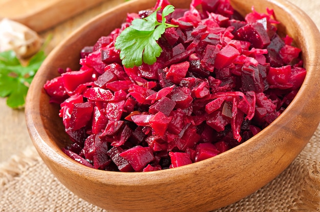 Beet salad Vinaigrette in a wooden bowl