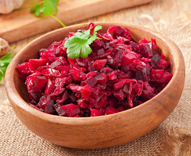 Free photo beet salad vinaigrette in a wooden bowl