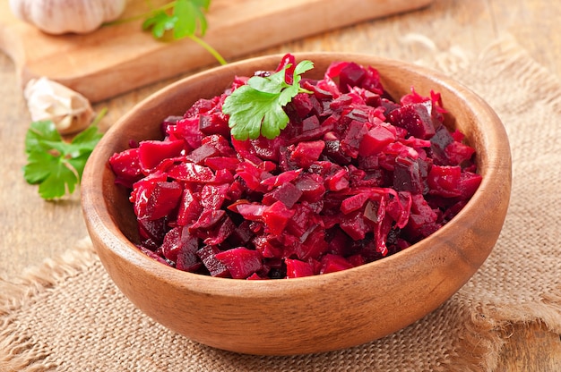 Beet salad Vinaigrette in a wooden bowl