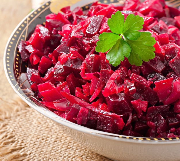 Beet salad Vinaigrette in a wooden bowl