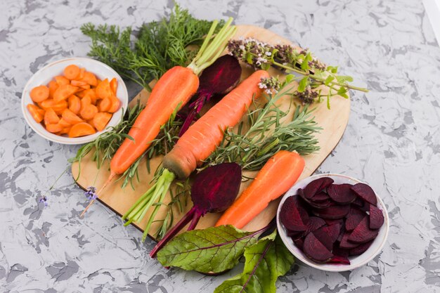 Beetroot and carrot on wooden board