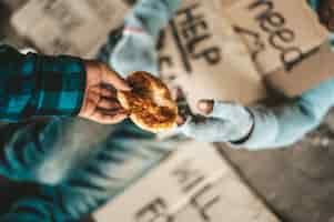 Free photo begging under the bridge with the person who handed the bread.