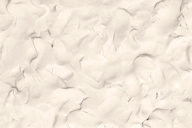 Бесплатное фото Текстурированный фон бежевой глины в абстрактном стиле минимализма diy творческого искусства