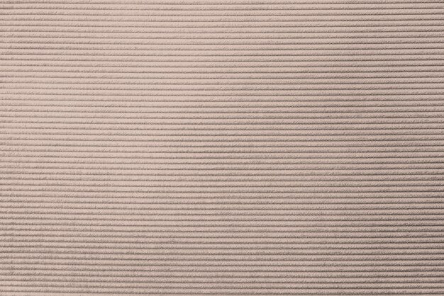 ベージュのコーデュロイ生地の織り目加工の背景