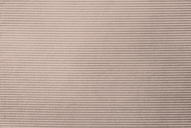 ベージュのコーデュロイ生地の織り目加工の背景