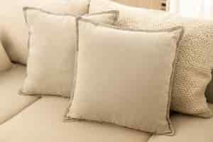 Free photo beige cushions home decor, on a sofa