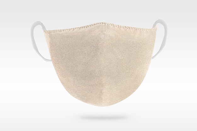 Beige protective cloth mask on white