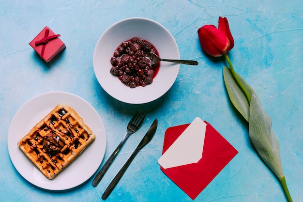 Belgian waffle with berries on plate