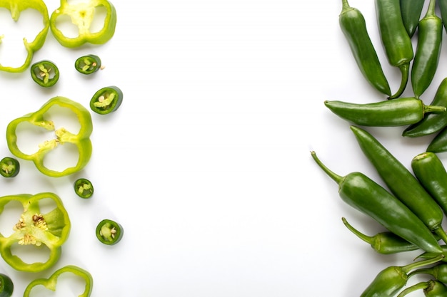 Bell pepper fresh ripe sliced green bell pepper along with spicy green pepper on white background