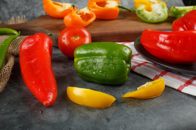 Bell peppers on a piece of stone.