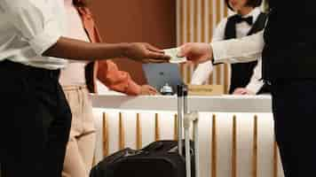 Free photo bellboy tipped by company executives