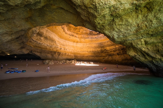  Benagil Cave Boat Tour inside Algar de Benagil, cave listed in the world's top 10 best caves. Algarve coast near Lagoa, Portugal. Tourists visit a popular landmark