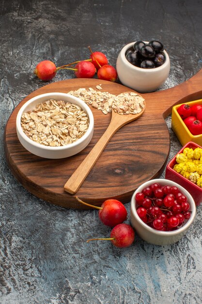 berries oatmeal spoon on the cutting board colorful berries candies