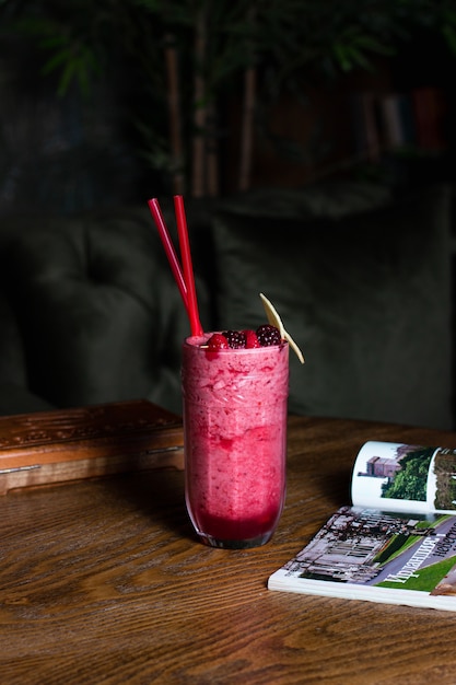 Berry smoothie with berries and straws