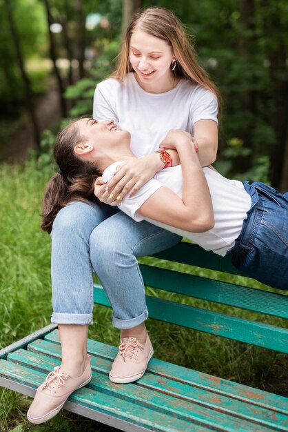 Best friends on a bench talking