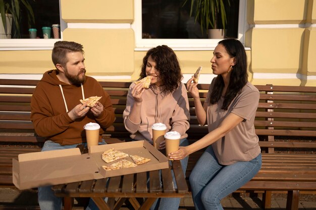 Best friends eating some street food