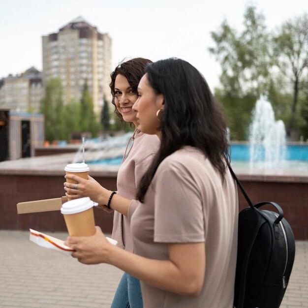 Best friends eating some street food