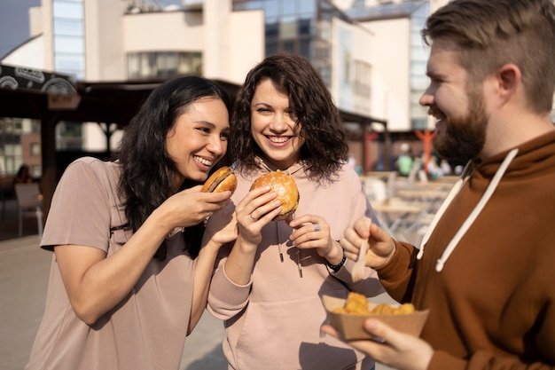 Best friends eating street food