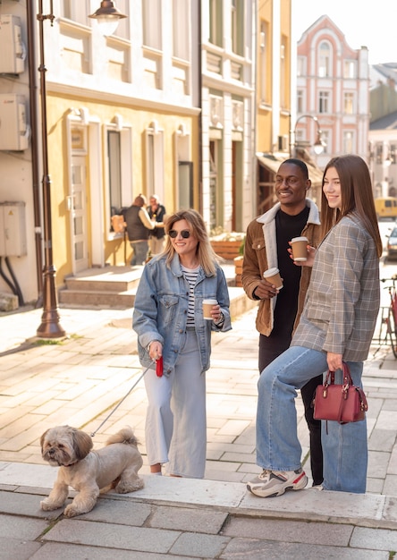 Free photo best friends hanging out while enjoying a cup of coffee