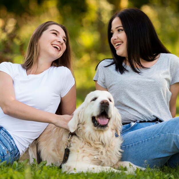 Best friends hanging out with a dog