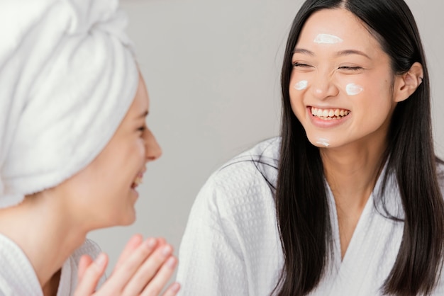 Best friends having a beauty treatment at home