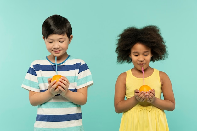 Best friends having fun in a blue summer setting studio