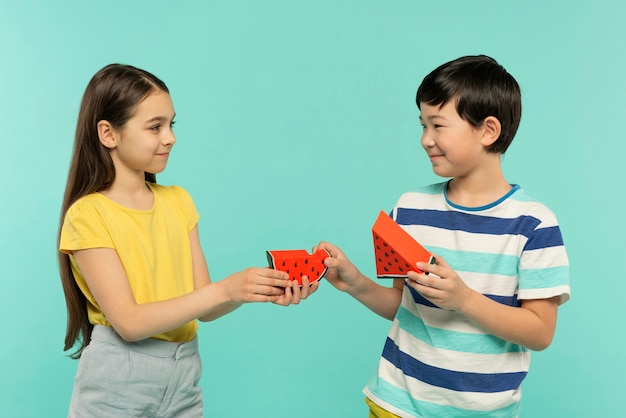 Free photo best friends having fun in a blue summer setting studio