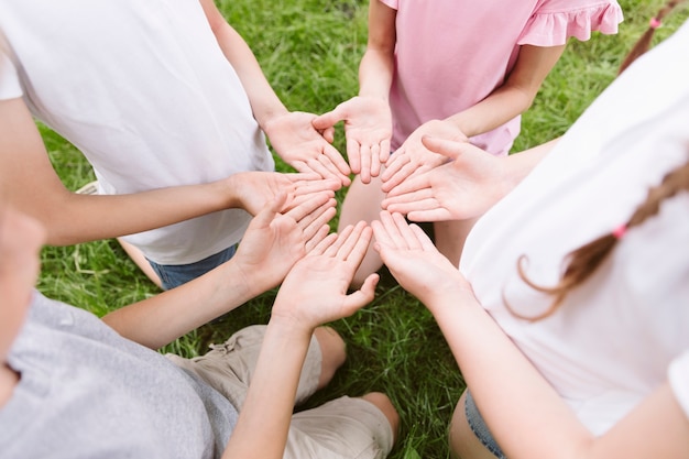 Best friends making a flower with their hands