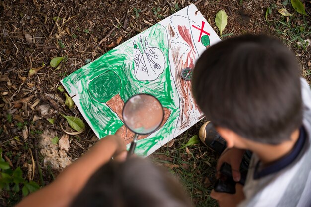 Best friends participating in a treasure hunt outdoors