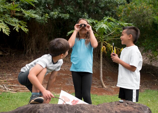 Best friends participating in a treasure hunt outdoors