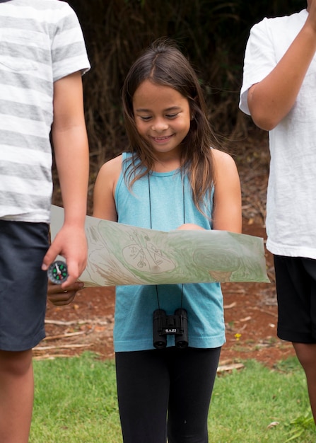 Best friends participating in a treasure hunt outdoors
