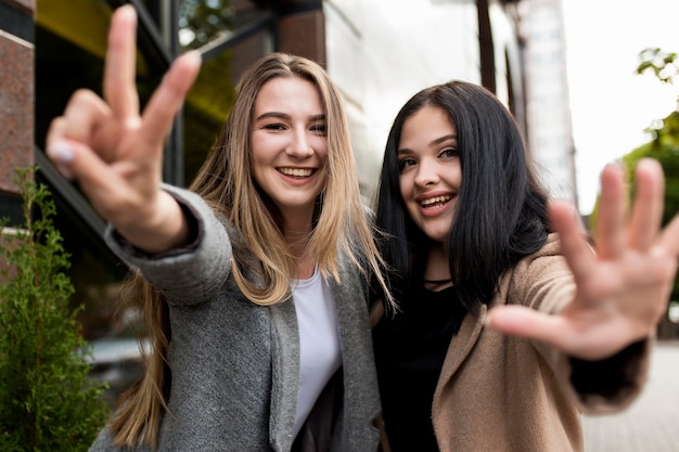 Free photo best friends posing in a fun way