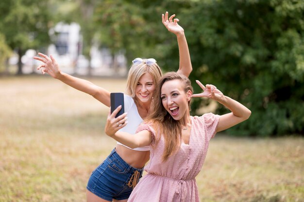 Best friends posing in a silly way for a selfie