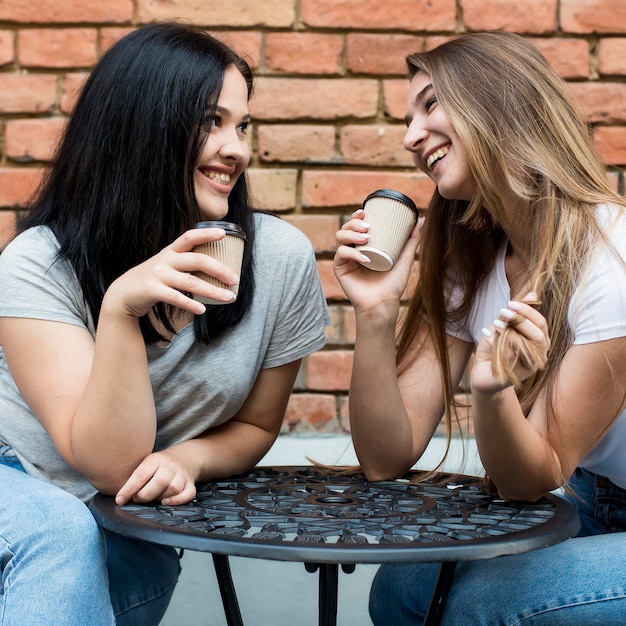 Best friends taking their coffee together