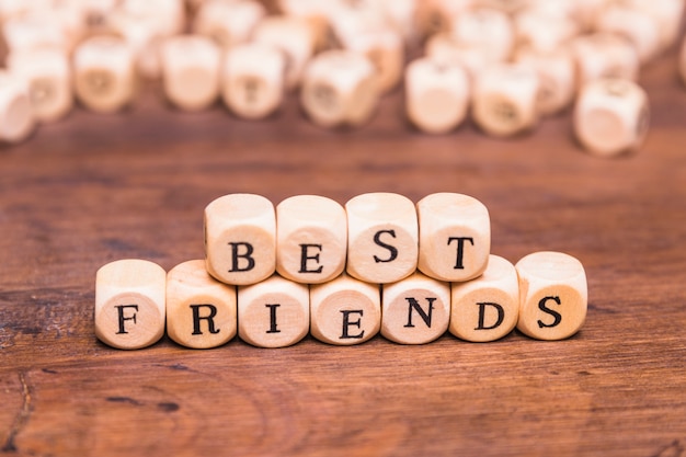 Best friends word with wooden dices over desk