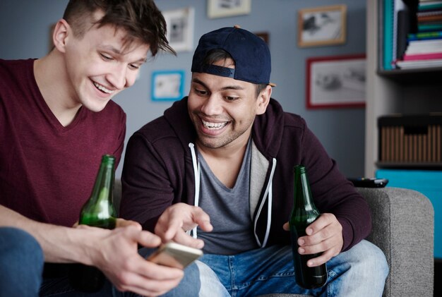 Best mates with cell phone and drinks