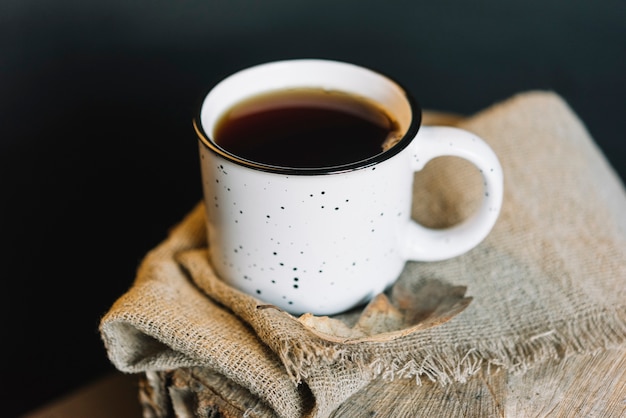 Beverage and leaf on cloth