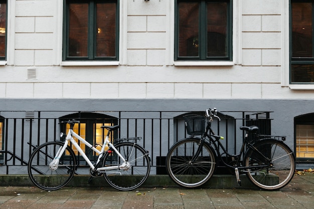 Bicycles on sidewalk against building