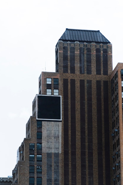 Free photo big billboard template on building in city