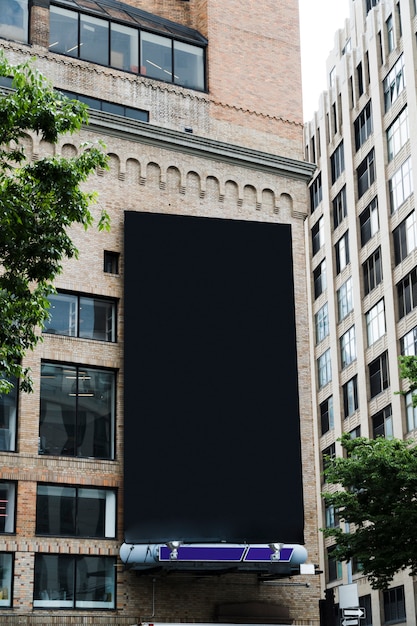 Free photo big billboard template on building in city