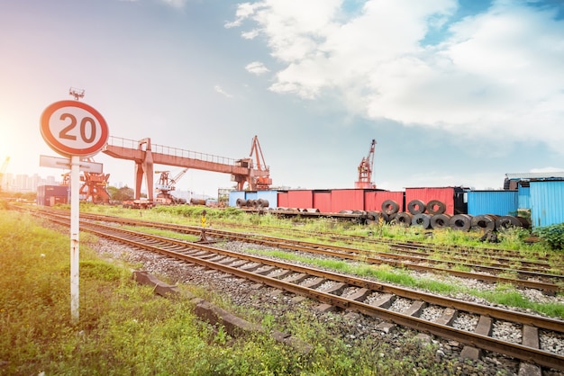 Big containers on the side of the rail