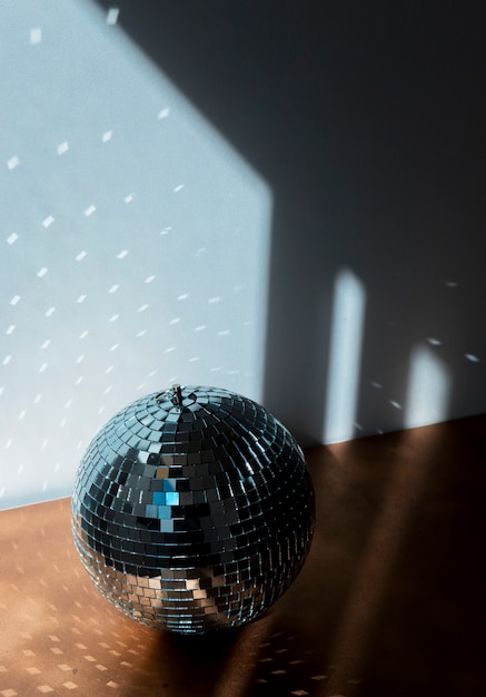 Big disco ball on brown floor