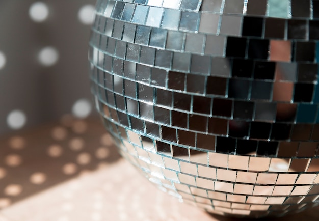 Big disco ball on floor with party lights