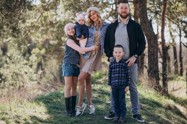 Big family with kids together in the forest