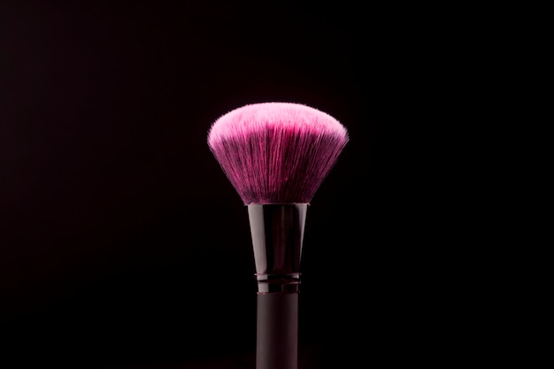 Big makeup brush with dry color substance