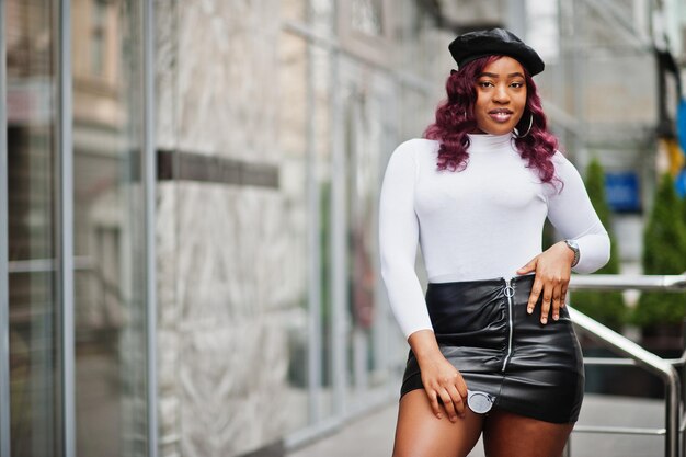 Big mama plus size african american model in black beret and leather skirt posed outdoor